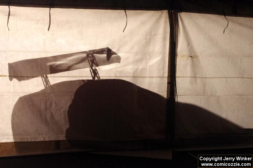 One of the Fix Rim Team Chevy Camaros casts a shadow on the tent.