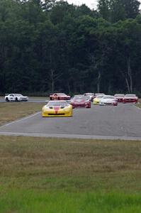 The field streams into turn four on the first lap.