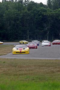 The field streams into turn four on the first lap.