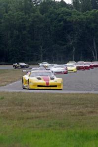 The field streams into turn four on the first lap.