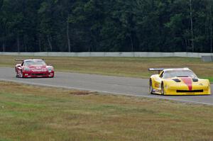 Tony Ave's Chevy Corvette and Amy Ruman's Chevy Corvette head into turn 4.