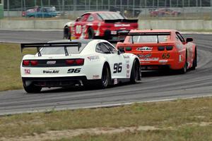 Mike Wilson's Chevy Monte Carlo, Tom Sheehan's Chevy Camaro and Cris Liesfeld's Chevy Camaro at turn 4.