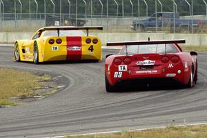 Amy Ruman's Chevy Corvette chases Tony Ave's Chevy Corvette through turn 4.