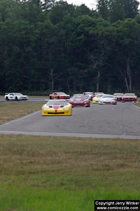 The field streams into turn four on the first lap.