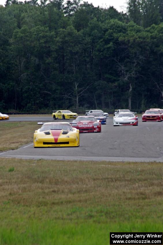 The field streams into turn four on the first lap.