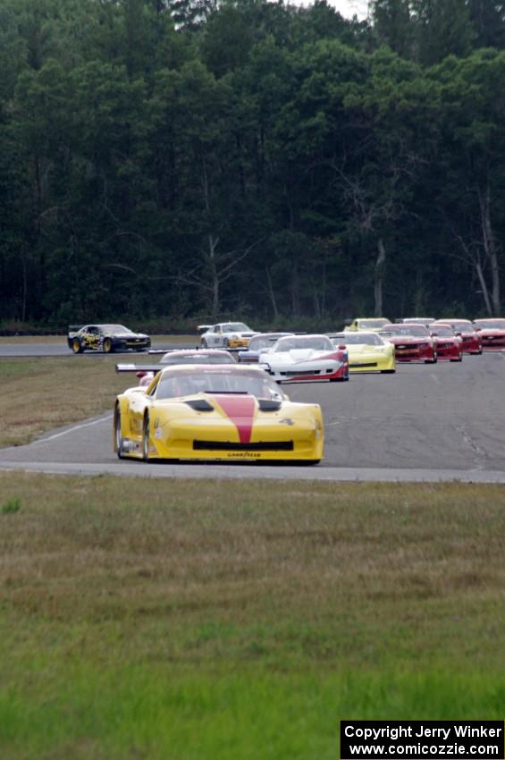 The field streams into turn four on the first lap.