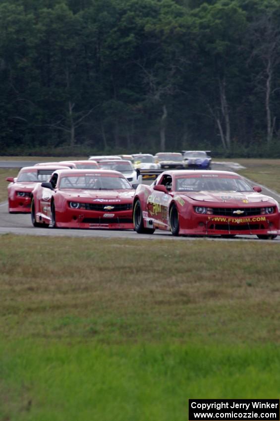 The TA2 field comes into turn 4 on the first lap.