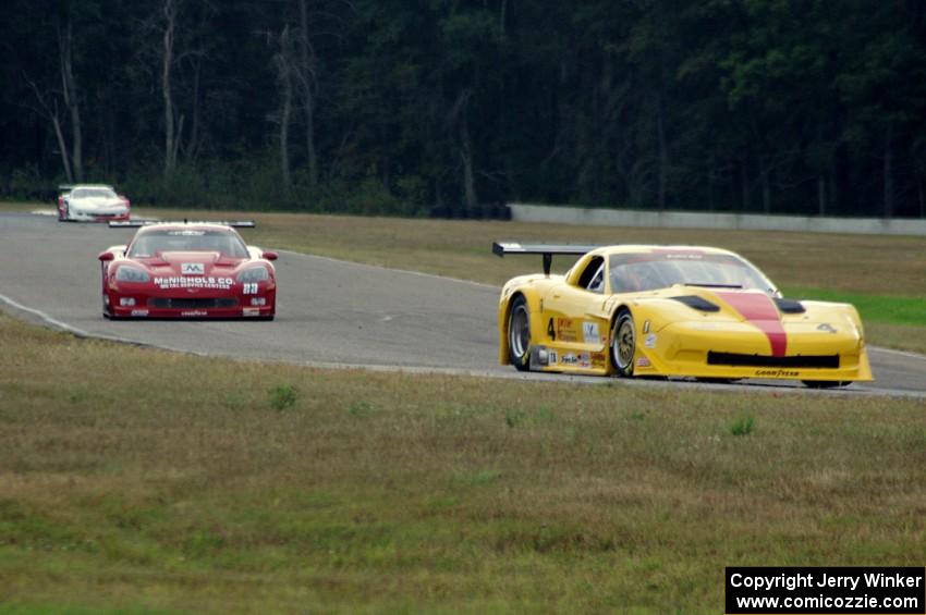 Tony Ave's Chevy Corvette and Amy Ruman's Chevy Corvette head into turn 4.