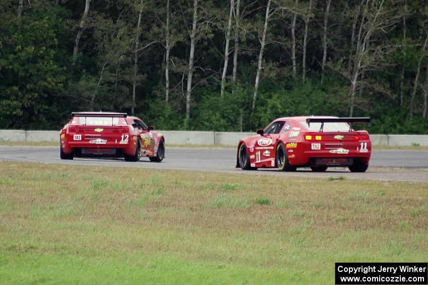 Bob Stretch's Chevy Camaro, Pete Halsmer's Chevy Camaro and Cameron Lawrence's Chevy Camaro battle for the lead in TA2.