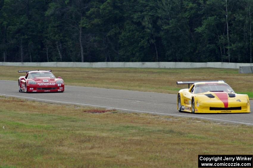 Tony Ave's Chevy Corvette and Amy Ruman's Chevy Corvette head into turn 4.