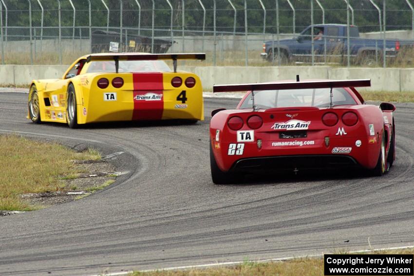 Amy Ruman's Chevy Corvette chases Tony Ave's Chevy Corvette through turn 4.