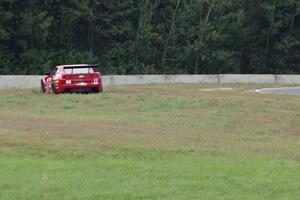 Cameron Lawrence's Chevy Camaro pulls off at turn 5.