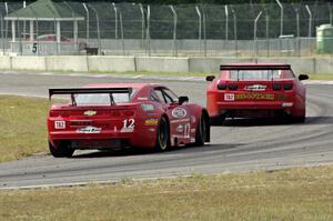 Pete Halsmer's Chevy Camaro chases Bob Stretch's Chevy Camaro