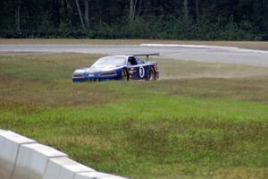 Matt Crandall's Ford Mustang pulls off between turns 3 and 4 with a blown tire.