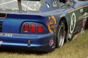 Matt Crandall's Ford Mustang pulls off at turn 4 with a blown tire.