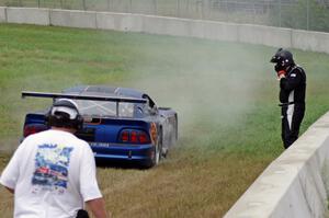 Matt Crandall's Ford Mustang pulls off at turn 4 with a blown tire.