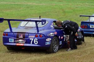 Chuck Cassaro's Panoz GTS is a DNF at turn 4. Matt Crandall stops to chat.