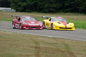 Tony Ave's Chevy Corvette and Amy Ruman's Chevy Corvette go side-by-side into turn 4.