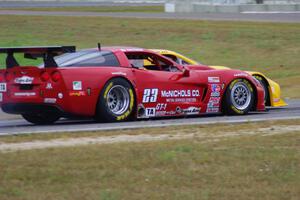 Tony Ave's Chevy Corvette nips Amy Ruman's Chevy Corvette into turn 4.