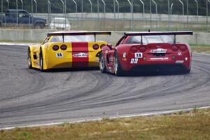 Tony Ave's Chevy Corvette leads Amy Ruman's Chevy Corvette through turn 4.