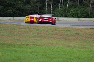 Tony Ave's Chevy Corvette leads Amy Ruman's Chevy Corvette through turn 5.