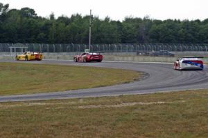 Amy Ruman's Chevy Corvette holds off Simon Gregg's Chevy Corvette at turn 4 with two laps to go.