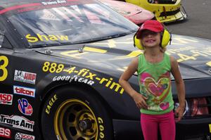 A young fan in front of Mel Shaw's Chevy Camaro after the second race on Sunday.
