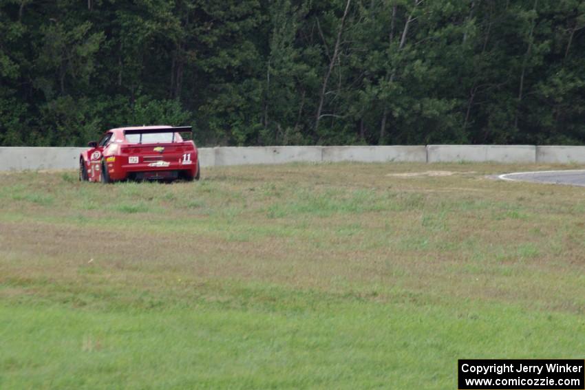 Cameron Lawrence's Chevy Camaro pulls off at turn 5.