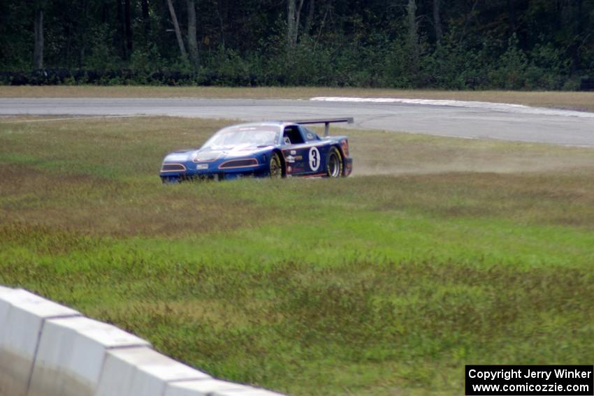 Matt Crandall's Ford Mustang pulls off between turns 3 and 4 with a blown tire.