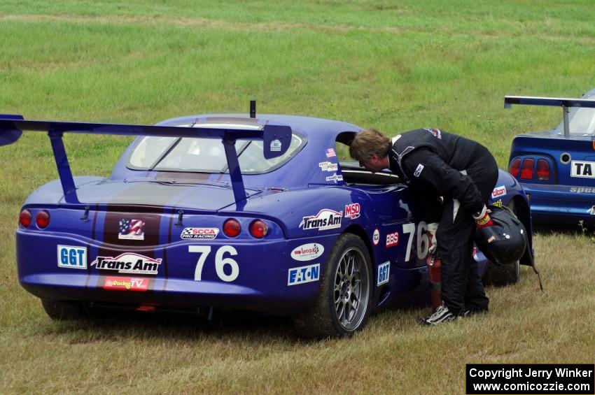 Chuck Cassaro's Panoz GTS is a DNF at turn 4. Matt Crandall stops to chat.