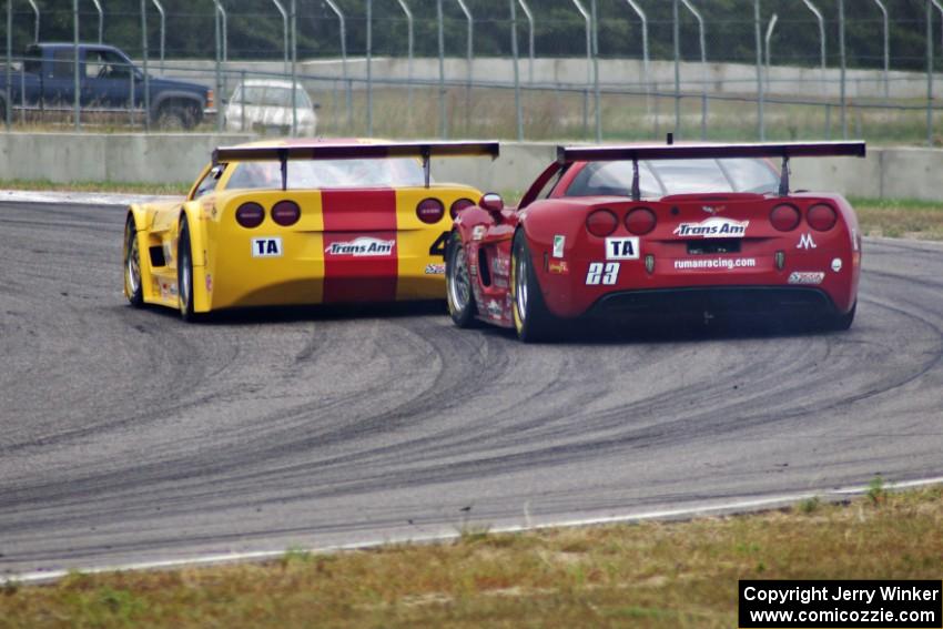 Tony Ave's Chevy Corvette leads Amy Ruman's Chevy Corvette through turn 4.