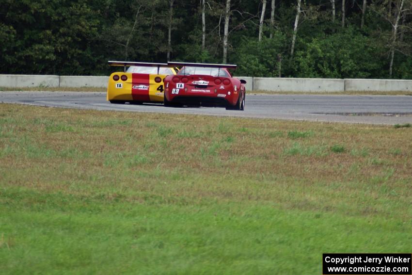 Tony Ave's Chevy Corvette leads Amy Ruman's Chevy Corvette through turn 5.