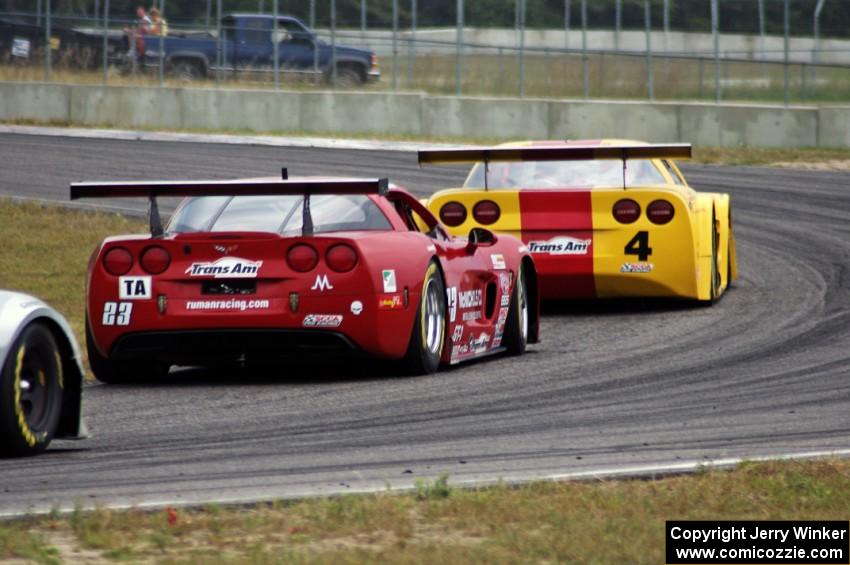 Amy Ruman's Chevy Corvette chases Tony Ave's Chevy Corvette through turn 4.