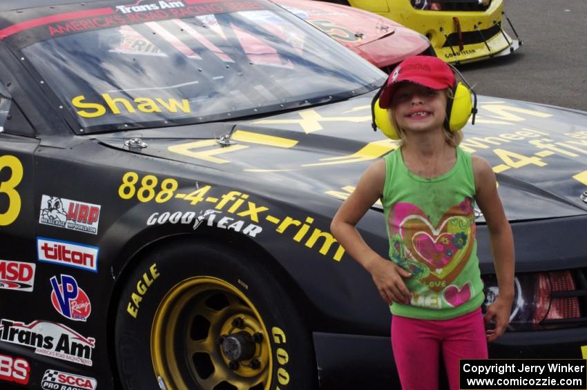 A young fan in front of Mel Shaw's Chevy Camaro after the second race on Sunday.