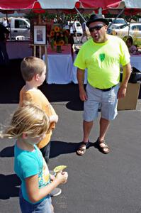 One of the volunteers sings opera to a couple of kids.