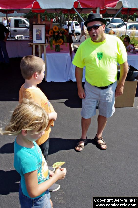 One of the volunteers sings opera to a couple of kids.