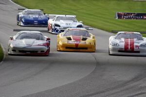Three wide into tghe carousel: the Chevy Corvettes of Simon Gregg, Paul Fix and Kyle Kelley