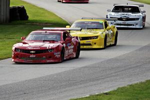 The Chevy Camaros of Cameron Lawrence, Bob Stretch and Rob Huffmaster enter the carousel