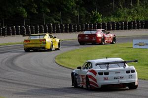 Cameron Lawrence's Chevy Camaro ahead of Bob Stretch's Chevy Camaro and Rob Huffmaster's Chevy Camaro