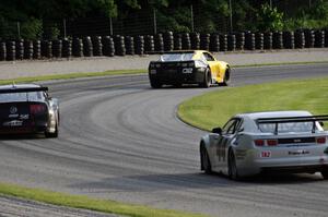 John Atwell's Chevy Camaro ahead of Tom West's Ford Mustang and Kurt Roehrig's Chevy Camaro