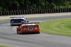 David Fershtand's Chevy Corvette chases Rick Dittman's Chevy Corvette through the carousel