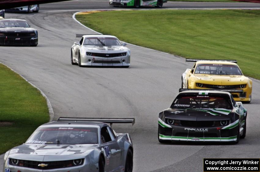 The Chevy Camaros of Kurt Roehrig, Gregg Rodgers, John Atwell, Adam Andretti and Tom West's Ford Mustang