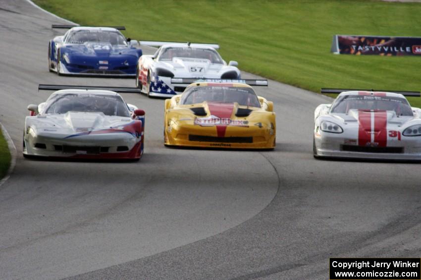 Three wide into tghe carousel: the Chevy Corvettes of Simon Gregg, Paul Fix and Kyle Kelley