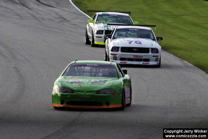 Bill Prietzel's Chevy Monte Carlo, Chuck Cassaro's Ford Mustang and Rob Bodle's Ford Mustang