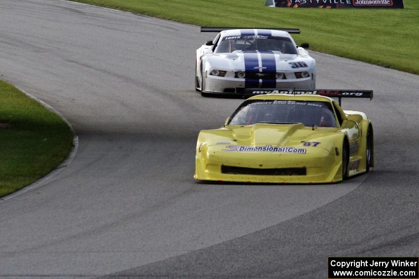 Doug Peterson's Chevy Corvette and Cliff Ebben's Ford Mustang enter the carousel