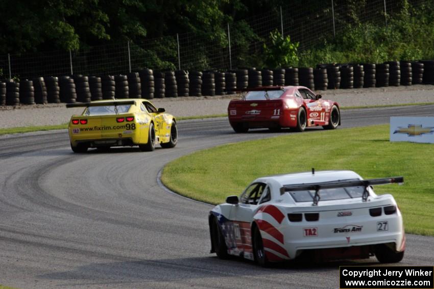 Cameron Lawrence's Chevy Camaro ahead of Bob Stretch's Chevy Camaro and Rob Huffmaster's Chevy Camaro