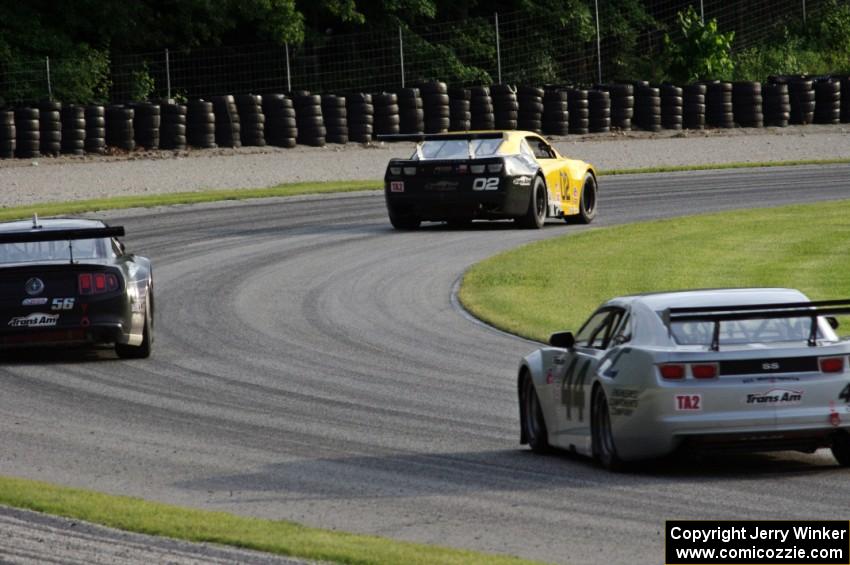 John Atwell's Chevy Camaro ahead of Tom West's Ford Mustang and Kurt Roehrig's Chevy Camaro