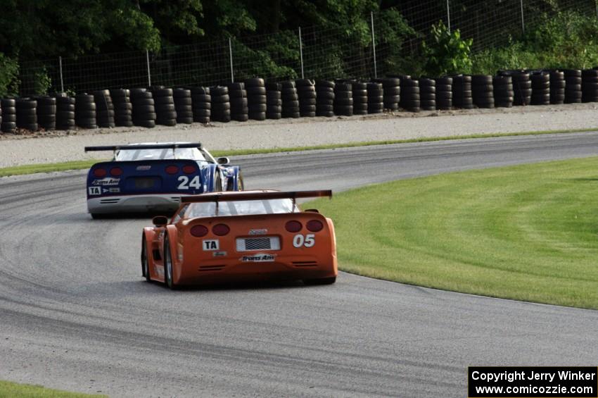 David Fershtand's Chevy Corvette chases Rick Dittman's Chevy Corvette through the carousel