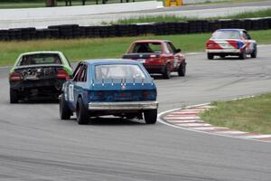 Four cars head through turn 13