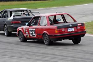 Blunderbus(t) BMW 318 trails the Wheels Off Racing Ford Taurus SHO